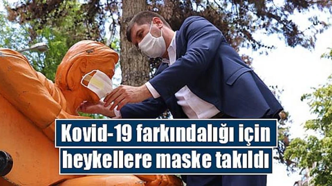 Kovid-19 farkındalığı için heykellere maske takıldı