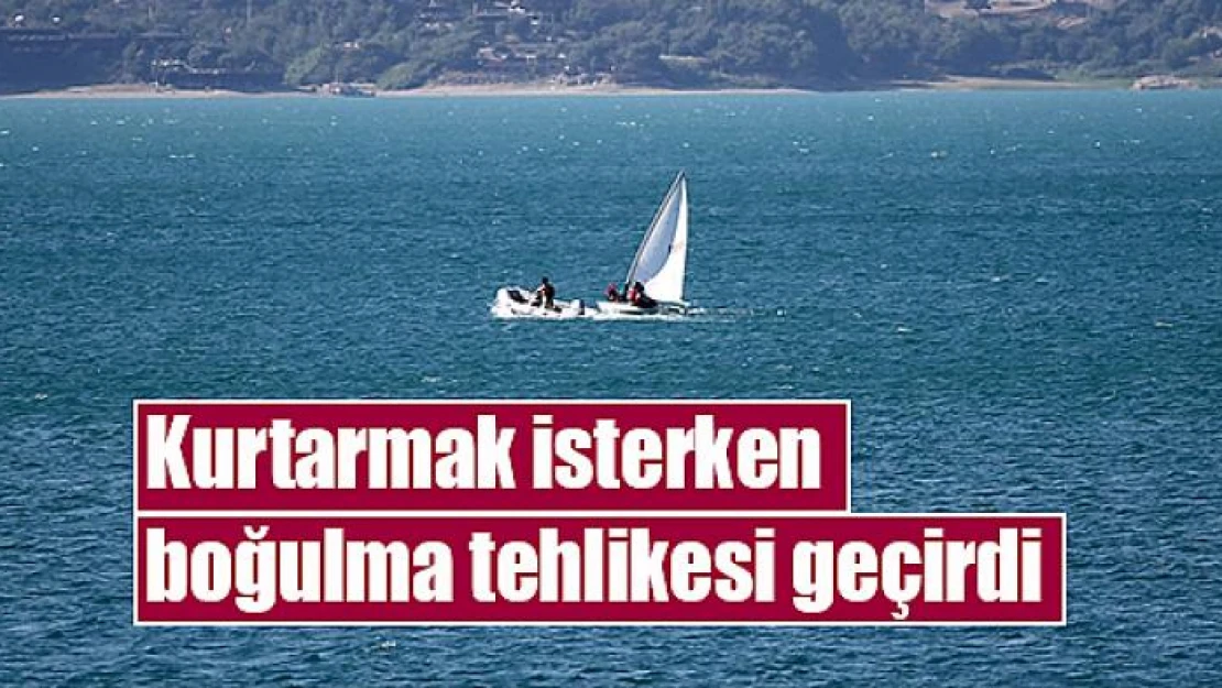 Kurtarmak isterken boğulma tehlikesi geçirdi