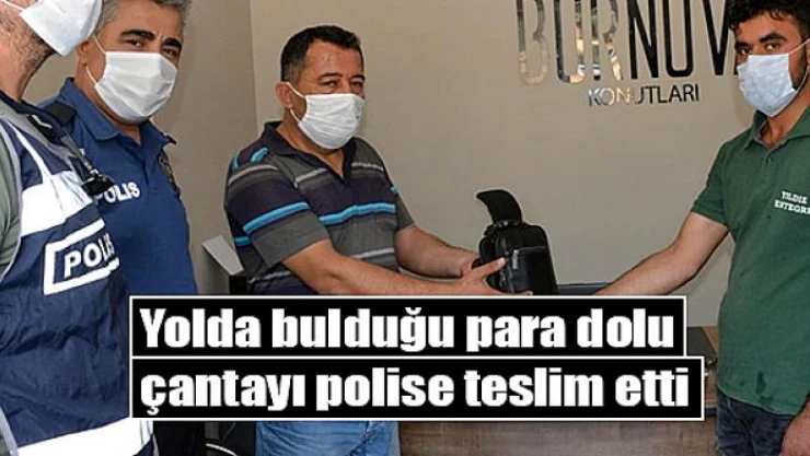 Yolda bulduğu para dolu çantayı polise teslim etti